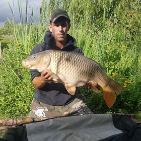 Angler with a 21lb carp caught at Alderwood Fishery