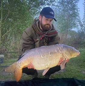 James with a carp caught at Alderwood Fishery