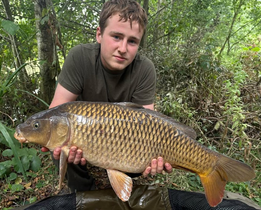 Daniel with a carp caught at Alderwood Fishery