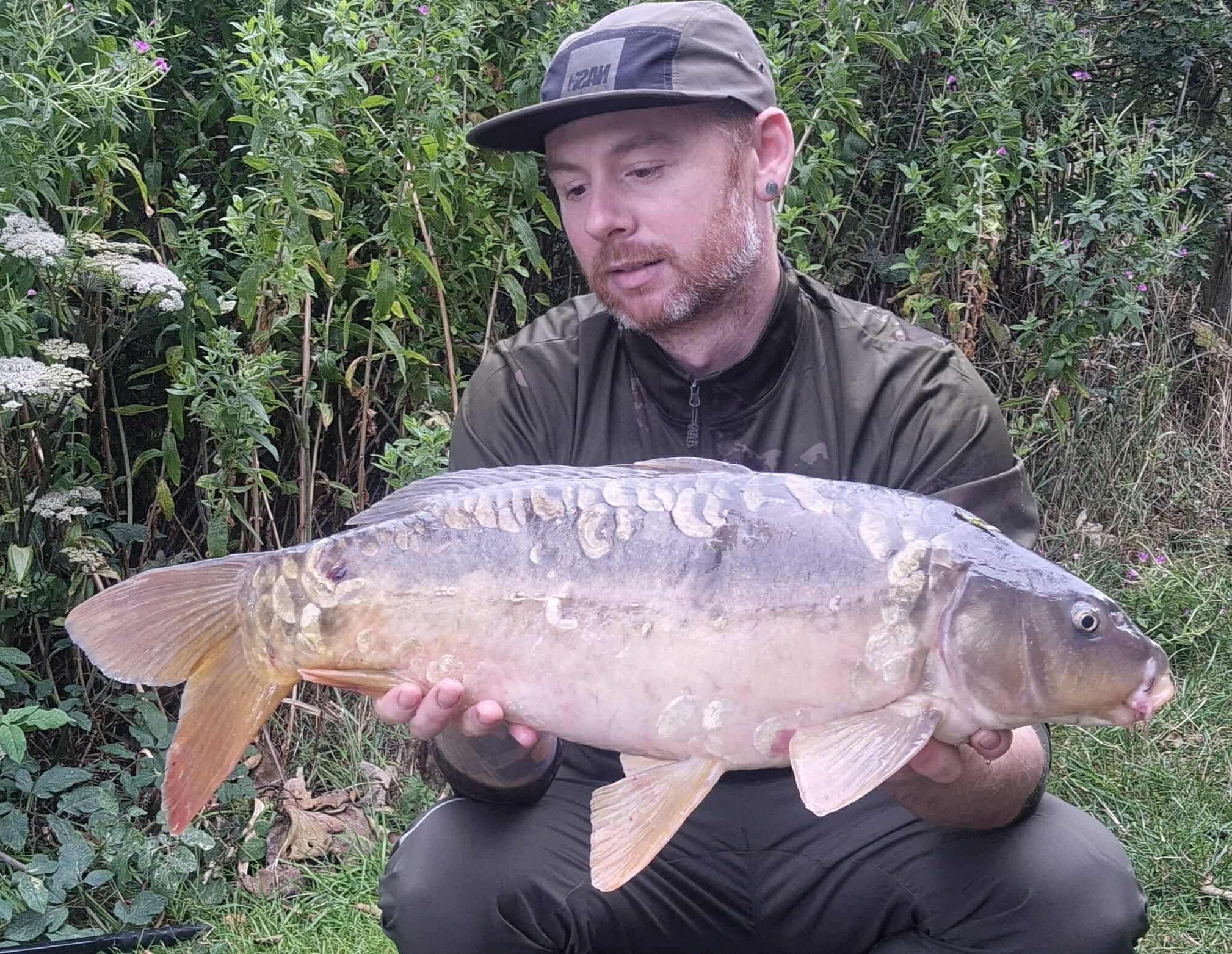 Corey with a carp caught at Alderwood Fishery