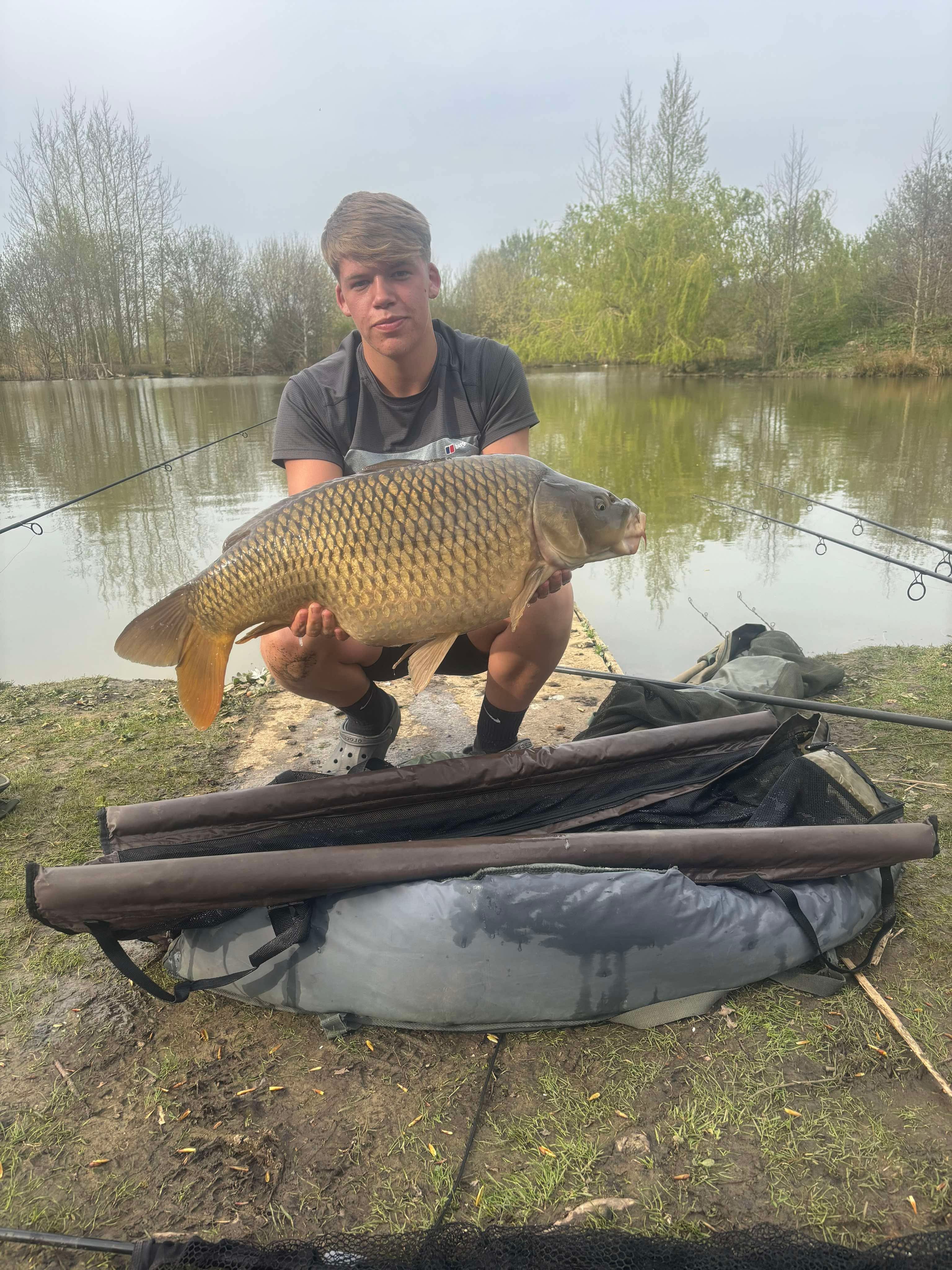 Jordon with a carp caught at Alderwood Fishery