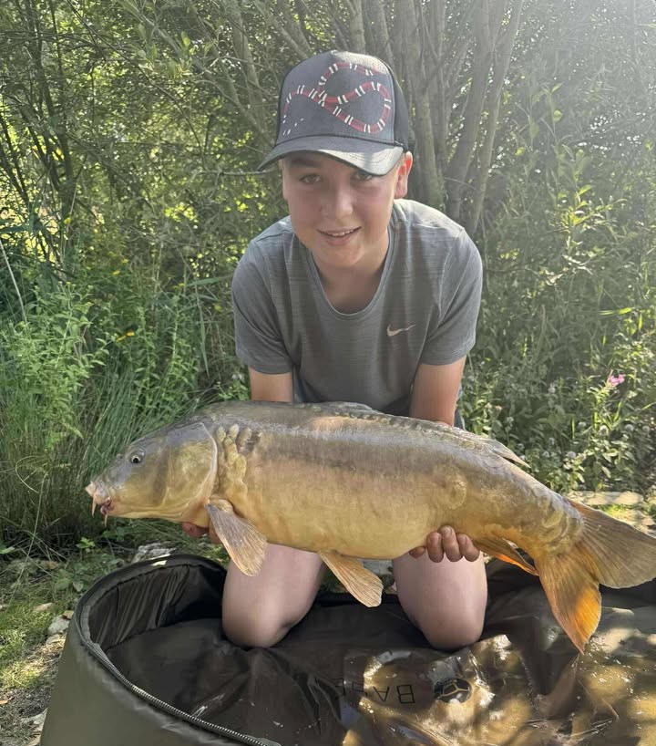 Max with a carp caught at Alderwood Fishery