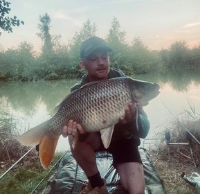 Angler with a carp caught at Alderwood Fishery