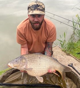 Angler with a carp caught at Alderwood Fishery
