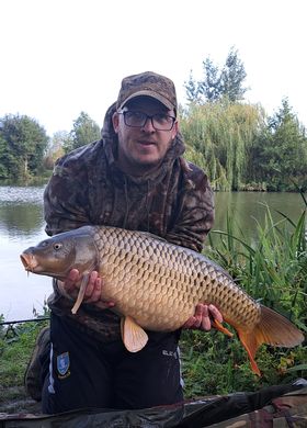 Angler with a carp caught at Alderwood Fishery