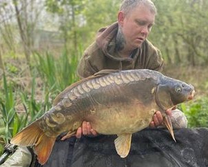 Lenny with a carp caught at Alderwood Fishery
