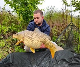 Angler with a carp caught at Alderwood Fishery